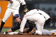 SAN FRANCISCO - AUGUST 28: Troy Tulowitizki #2 of the Colorado Rockies is tagged out on a steal attempt by Edgar Renteria #16 of the San Francisco Giants in the second inning during a Major League Baseball game at AT&T Park on August 28, 2009 in San Francisco, California.  (Photo by Jed Jacobsohn/Getty Images)