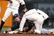 SAN FRANCISCO - AUGUST 28: Troy Tulowitizki #2 of the Colorado Rockies is tagged out on a steal attempt by Edgar Renteria #16 of the San Francisco Giants in the second inning during a Major League Baseball game at AT&T Park on August 28, 2009 in San Francisco, California.  (Photo by Jed Jacobsohn/Getty Images)