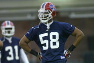 ORCHARD PARK, NY - MAY 01: Aaron Maybin #58, 2009 first round draft pick of the Buffalo Bills waits in between plays during Buffalo Bills minicamp at the Buffalo Bills Fieldhouse on May 1, 2009 in Orchard Park, New York.  (Photo by Rick Stewart/Getty Images)