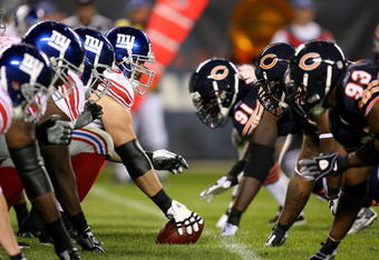 CHICAGO - AUGUST 22: The offensive line of the New York Giants waits to take on the defensive line of the Chicago Bears during a pre-season game on August 22, 2009 at Soldier Field in Chicago, Illinois. The Bears defeated the Giants 17-3. (Photo by Jonathan Daniel/Getty Images)