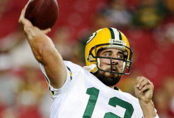 GLENDALE, AZ - AUGUST 28:  Quarterback Aaron Rodgers #12 of the Green Bay Packers warms up prior to the game against the Arizona Cardinals at the University of Phoenix Stadium on August 28, 2009 in Glendale, Arizona.  (Photo by Christian Petersen/Getty Images)