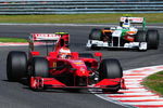 SPA FRANCORCHAMPS, BELGIUM - AUGUST 30:  Race winner Kimi Raikkonen of Finland and Ferrari leads from second placed Giancarlo Fisichella of Italy and Force India during the Belgian Grand Prix at the Circuit of Spa Francorchamps on August 30, 2009 in Spa Francorchamps, Belgium.  (Photo by Clive Mason/Getty Images)