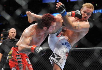PORTLAND, OR - AUGUST 29:  UFC fighter Chris Leben (L) battles UFC fighter Jake Rosholt (R) during their Middleweight bout at UFC 102:  Couture vs. Nogueira at the Rose Garden Arena on August 29, 2009 in Portland, Oregon.  (Photo by Jon Kopaloff/Getty Images)
