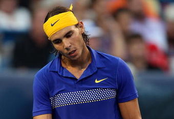 CINCINNATI - AUGUST 22:  Rafael Nadal of Spain reacts to a missed shot against Novak Djokovic of Serbia in their semi final during day six of the Western & Southern Financial Group Masters on August 22, 2009 at the Lindner Family Tennis Center in Cincinnati, Ohio.  (Photo by Nick Laham/Getty Images)