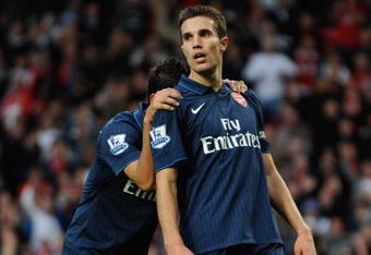 MANCHESTER, ENGLAND - AUGUST 29:  Robin van Persie (R) of Arsenal shows his dejection with team mate Eduardo after having a goal disallowed during the Barclays Premier League match between Manchester United and Arsenal at Old Trafford on August 29, 2009 in Manchester, England.  (Photo by Laurence Griffiths/Getty Images)