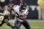 HOUSTON - AUGUST 22:  Running back Steve Slaton #20 of the Houston Texans rushes past cornerback Jabari Greer #32 of the New Orleans Saints on August 22, 2009 in Houston, Texas.  (Photo by Bob Levey/Getty Images)