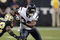 HOUSTON - AUGUST 22:  Running back Steve Slaton #20 of the Houston Texans rushes past cornerback Jabari Greer #32 of the New Orleans Saints on August 22, 2009 in Houston, Texas.  (Photo by Bob Levey/Getty Images)