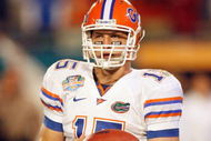 MIAMI - JANUARY 08:  Tim Tebow #15 of the Florida Gators looks to the sidelines against the Oklahoma Sooners during the FedEx BCS National Championship Game at Dolphin Stadium on January 8, 2009 in Miami, Florida.  (Photo by Eliot J. Schechter/Getty Images