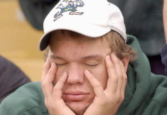SOUTH BEND, IN - NOVEMBER 1:  A Notre Dame fan looks sleepy and disappointed as Florida State takes a commanding lead during a game on November 1, 2003 at the Notre Dame Stadium in South Bend, Indiana. (Photo by Jonathan Daniel/Getty Images)