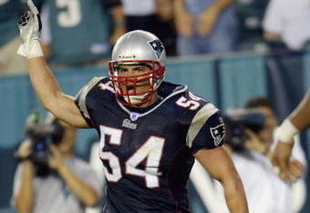 PHILADELPHIA - SEPTEMBER 14:   Linebacker Tedy Bruschi #54 of the New England Patriots celebrates after returning an interception for a touchdown during the NFL game against the Philadelphia Eagles on September 14, 2003 at Lincoln Financial Field in Philadelphia, Pennsylvania. The Patriots defeated the Eagles 31-10.  (Photo by Nick Laham/Getty Images)