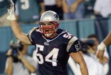 PHILADELPHIA - SEPTEMBER 14:   Linebacker Tedy Bruschi #54 of the New England Patriots celebrates after returning an interception for a touchdown during the NFL game against the Philadelphia Eagles on September 14, 2003 at Lincoln Financial Field in Philadelphia, Pennsylvania. The Patriots defeated the Eagles 31-10.  (Photo by Nick Laham/Getty Images)