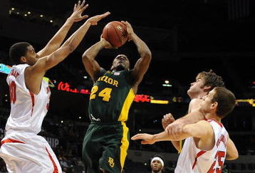 OKLAHOMA CITY - MARCH 11: Guard LaceDarius Dunn #24 of the Baylor Bears takes a shot against Toney McCray #30 of the Nebraska Cornhuskers during the Phillips 66 Big 12 Men's Basketball Championship at the Ford Center March 11, 2009 in Oklahoma City, Oklahoma.  (Photo by Ronald Martinez/Getty Images)