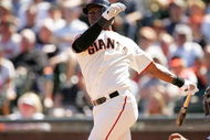 SAN FRANCISCO - AUGUST 30:  Edgar Renteria #16 of the San Francisco Giants hits a grand slam home run that scored Fred Lewis #14, Arron Rowand #33 and Juan Uribe #5 after Renteria and gave them a 6-5 lead over the Colorado Rockies ini the seventh inning at AT&T Park on August 30, 2009 in San Francisco, California.  (Photo by Ezra Shaw/Getty Images)