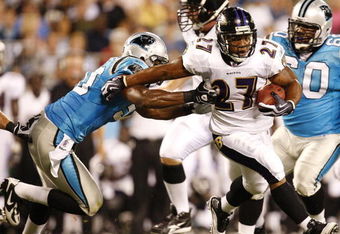 CHARLOTTE, NC - AUGUST 29: Running back Ray Rice #27 of the Baltimore Ravens breaks the tackle of linebacker James Anderson #50 the Carolina Panthers during their preseason game at Bank of America Stadium on August 29, 2009 in Charlotte, North Carolina. (Photo by Streeter Lecka/Getty Images)