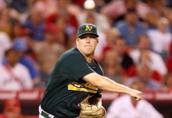 ANAHEIM, CA - AUGUST 29:  Pitcher Andrew Bailey #40 of the Oakland Athletics throws Howie Kendrick of the Los Angeles Angels of Anaheim out at first in the ninth inning at Angel Stadium on August 29, 2009 in Anaheim, California. The Athletics defeated the Angels 4-3.  (Photo by Jeff Gross/Getty Images)