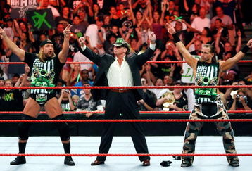 LAS VEGAS - AUGUST 24:  (L-R) Wrestler Triple H, World Wrestling Entertainment Inc. Chairman Vince McMahon and wrestler Shawn Michaels appear in the ring during the WWE Monday Night Raw show at the Thomas & Mack Center August 24, 2009 in Las Vegas, Nevada.  (Photo by Ethan Miller/Getty Images)
