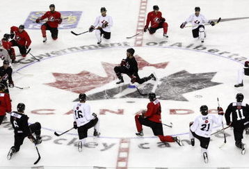 CALGARY, CANADA - AUGUST 24: Scott Niedermayer (centre) leads the stretching during the second practice of theTeam Canada Olympic Orientation Camp on August 24, 2009 at the Pengrowth Saddledome in Calgary, Alberta, Canada. (Photo by Mike Ridewood/Getty Images)