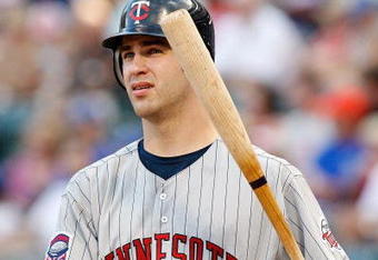 ARLINGTON, TX - JULY 17:  Catcher Joe Mauer #7 of the Minnesota Twins on July 17, 2009 at Rangers Ballpark in Arlington, Texas.  (Photo by Ronald Martinez/Getty Images)