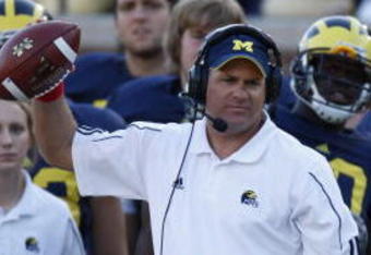 ANN ARBOR, MI - SEPTEMBER 27:  Head coach Rich Rodriguez of the Michigan Wolverines holds a football during the game against the Wisconsin Badgers on September 27, 2008 at Michigan Stadium in Ann Arbor, Michigan. (Photo by Gregory Shamus/Getty Images) 