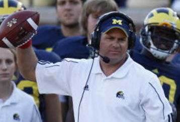 ANN ARBOR, MI - SEPTEMBER 27:  Head coach Rich Rodriguez of the Michigan Wolverines holds a football during the game against the Wisconsin Badgers on September 27, 2008 at Michigan Stadium in Ann Arbor, Michigan. (Photo by Gregory Shamus/Getty Images) 