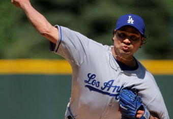 DENVER - AUGUST 27:  Starting pitcher Vicente Padilla #44 of the Los Angeles Dodgers delivers against the Colorado Rockies at Coors Field on August 27, 2009 in Denver, Colorado. The Dodgers defeated the Rockies 3-2.  (Photo by Doug Pensinger/Getty Images)