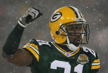 GREEN BAY, WI - JANUARY 12:  Cornerback Charles Woodson #21 of the Green Bay Packers celebrates in the final moments as the Packers defeated the Seattle Seahawks 42-20 during the NFC divisional playoff game on January 12, 2008 at Lambeau Field in Green Bay, Wisconsin.  (Photo by Jonathan Daniel/Getty Images)