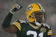 GREEN BAY, WI - JANUARY 12:  Cornerback Charles Woodson #21 of the Green Bay Packers celebrates in the final moments as the Packers defeated the Seattle Seahawks 42-20 during the NFC divisional playoff game on January 12, 2008 at Lambeau Field in Green Bay, Wisconsin.  (Photo by Jonathan Daniel/Getty Images)