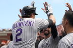 SAN FRANCISCO - AUGUST 30:  Troy Tulowitzki #2 of the Colorado Rockies is congratulated by teammates after he hit a home run that gave the Rockies a 3-1 lead over the San Francisco Giants in the fifth inning at AT&T Park on August 30, 2009 in San Francisco, California.  (Photo by Ezra Shaw/Getty Images)