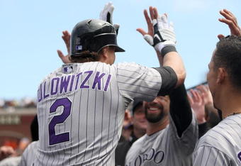SAN FRANCISCO - AUGUST 30:  Troy Tulowitzki #2 of the Colorado Rockies is congratulated by teammates after he hit a home run that gave the Rockies a 3-1 lead over the San Francisco Giants in the fifth inning at AT&T Park on August 30, 2009 in San Francisco, California.  (Photo by Ezra Shaw/Getty Images)