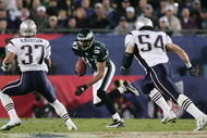 JACKSONVILLE, FLORIDA - FEBRUARY 06:  Wide receiver Todd Pinkston #87 of the Philadelphia Eagles looks for an opening around Rodney Harrison #37 and Tedy Bruschi #54 of the New England Patriots after catching a 17-yard pass against the New England Patriots in the second quarter during Super Bowl XXXIX at Alltel Stadium on February 6, 2005 in Jacksonville, Florida.  (Photo by Jed Jacobsohn/Getty Images)