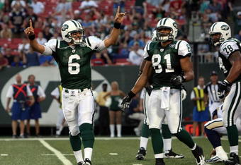 EAST RUTHERFORD, NJ - AUGUST 14:  Mark Sanchez #6 of the New York Jets celebrates his first touchdown during the preseason game against the St. Louis Rams at Giants Stadium on August 14, 2009  in East Rutherford, New Jersey.  (Photo by Nick Laham/Getty Images)