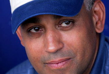 PORT ST. LUCIE, FL - MARCH 7:  General Manager Omar Minaya of the New York Mets before a game with the Atlanta Braves during MLB Spring Training on March 7, 2005 at Tradition Field in Port St. Lucie, Florida.  (Photo by Ronald Martinez/Getty Images)