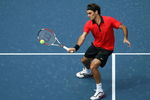 NEW YORK - AUGUST 31:  Roger Federer of Switzerland returns a shot against Devin Britton of the United States during day one of the 2009 U.S. Open at the USTA Billie Jean King National Tennis Center on August 31, 2009 in Flushing neighborhood of the Queens borough of New York City.  (Photo by Al Bello/Getty Images)