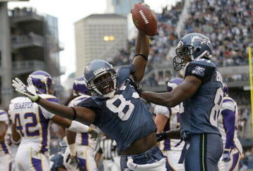SEATTLE - AUGUST 25:  Wide receiver Nate Burleson #81 of the Seattle Seahawks celebrates an apparent touchdown with Deion Branch #83 during a preseason game against the Minnesota Vikings at Qwest Field August 25, 2007 in Seattle, Washington. Burleson was just short of the goal line on the play and the ball was spotted at the 6 inch line. (Photo by Otto Greule Jr/Getty Images)