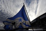 IRVING, TX - DECEMBER 20:  Dallas Cowboys flags fly outside Texas Stadium before the last home game against the Baltimore Ravens on December 20, 2008 in Irving, Texas. The Cowboys are playing their final regular season home game before moving to a new stadium in Arlington, Texas next season.  (Photo by Ronald Martinez/Getty Images)