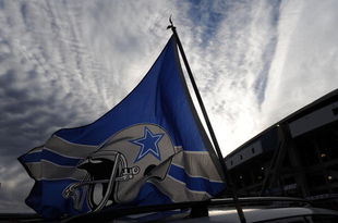 IRVING, TX - DECEMBER 20:  Dallas Cowboys flags fly outside Texas Stadium before the last home game against the Baltimore Ravens on December 20, 2008 in Irving, Texas. The Cowboys are playing their final regular season home game before moving to a new stadium in Arlington, Texas next season.  (Photo by Ronald Martinez/Getty Images)