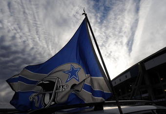 IRVING, TX - DECEMBER 20:  Dallas Cowboys flags fly outside Texas Stadium before the last home game against the Baltimore Ravens on December 20, 2008 in Irving, Texas. The Cowboys are playing their final regular season home game before moving to a new stadium in Arlington, Texas next season.  (Photo by Ronald Martinez/Getty Images)