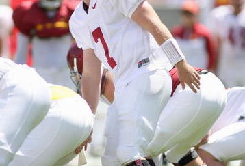 LOS ANGELES, CA - APRIL 25: Quarterback Matt Barkley #7 of the USC Trojans at the line of scrimmage during the spring game on April 25, 2009 at the Los Angeles Memorial Coliseum in Los Angeles, California.  The cardinal team won 16-10.  (Photo by Jeff Golden/Getty Images)