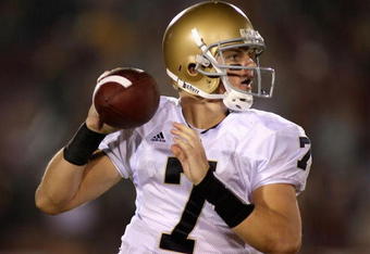 LOS ANGELES, CA - NOVEMBER 29:  Quarterback Jimmy Clausen #7 of the Notre Dame Fighting Irish in action during the game against the USC Trojans at Los Angeles Memorial Coliseum on November 29, 2008 in Los Angeles, California. The Trojans defeated the Fighting Irish 38-3.  (Photo by Christian Petersen/Getty Images)