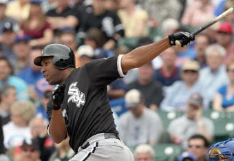 CHICAGO - JUNE 17: Jermaine Dye #23 of the Chicago White Sox makes a hit against the Chicago Cubs on June 17, 2009 at Wrigley Field in Chicago, Illinois. (Photo by Jonathan Daniel/Getty Images)
