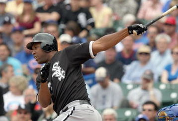 CHICAGO - JUNE 17: Jermaine Dye #23 of the Chicago White Sox makes a hit against the Chicago Cubs on June 17, 2009 at Wrigley Field in Chicago, Illinois. (Photo by Jonathan Daniel/Getty Images)