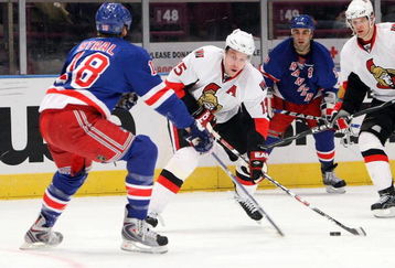NEW YORK - MARCH 22: Dany Heatley #15 of the Ottawa Senators skates with the puck under pressure from Marc Staal #18  of the New York Rangers on March 22, 2009 at Madison Square Garden in New York City, New York.  (Photo by Nick Laham/Getty Images)