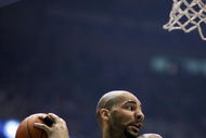 SALT LAKE CITY - APRIL 25:  Carlos Boozer #5 of the Utah Jazz comes down with a rebound in Game Four of the Western Conference Quarterfinals against the Los Angeles Lakers during the 2009 NBA Playoffs at Energy Solutions Arena on April 25, 2009 in Salt Lake City, Utah.  The Lakers won 108-94.  NOTE TO USER: User expressly acknowledges and agrees that, by downloading and/or using this Photograph, user is consenting to the terms and conditions of the Getty Images License Agreement.  (Photo by Otto Greule Jr/Getty Images)  