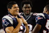 FOXBORO, MA - AUGUST 7: Tedy Bruschi #54 of the New England Patriots laughs from the sideline against the Baltimore Ravens during the preseason game at Gillette Stadium on August 7, 2008 in Foxboro, Massachusetts. (Photo by Jim Rogash/Getty Images)