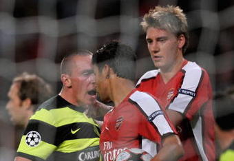 LONDON, ENGLAND - AUGUST 26:  Eduardo of Arsenal is confronted by Scott Brown of Celtic after winning a first half penalty for his team during the UEFA Champions League 2nd qualifying round 2nd leg match between Arsenal and Celtic at the Emirates Stadium on August 26, 2009 in London, England.  (Photo by Shaun Botterill/Getty Images)