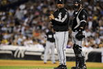 NEW YORK - SEPTEMBER 15:  Manager Ozzie Guillen #13 (L) and catcher A.J. Pierzynski #12 of the Chicago White Sox wait for a relief pitcher to enter the game against the New York Yankees on September 15, 2008 at Yankee Stadium in the Bronx borough of New York City.  (Photo by Jeff Zelevansky/Getty Images)