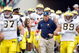 SOUTH BEND,IN - SEPTEMBER 13:  Head coach Rich Rodriguez of the Michigan Wolverines runs onto the field with his team before the game against the Notre Dame Fighting Irish on September 13, 2008 at Notre Dame Stadium in South Bend, Indiana. (Photo by: Gregory Shamus/Getty Images)