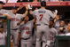 ANAHEIM, CA - JULY 24:  Joe Mauer #7 of the Minnesota Twins is greeted after hitting a home run in the fourth inning against the Los Angeles Angels of Anaheim on July 24, 2009 at Angel Stadium in Anaheim, California.  (Photo by Stephen Dunn/Getty Images)