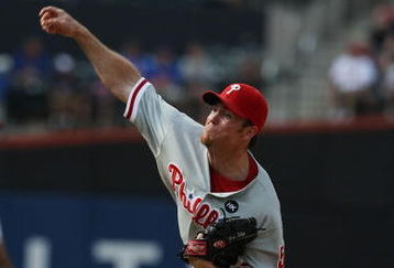 NEW YORK - AUGUST 23:  Brad Lidge #54 of the Philadelphia Phillies pitches against the New York Mets during their game on August 23, 2009 at Citi Field in the Flushing neighborhood of the Queens borough of New York City.  (Photo by Al Bello/Getty Images)