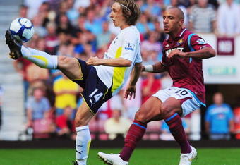 LONDON, ENGLAND - AUGUST 23:  Luka Modric of Tottenham Hotspur controls the ball as Julien Faubert of West Ham challenges during the Barclays Premier League match between West Ham United and Tottenham Hotspur on August 23, 2009 in London, England.  (Photo by Mike Hewitt/Getty Images)
